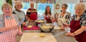 members make lots of baked goods breads and lefse for nordic fest.jpg